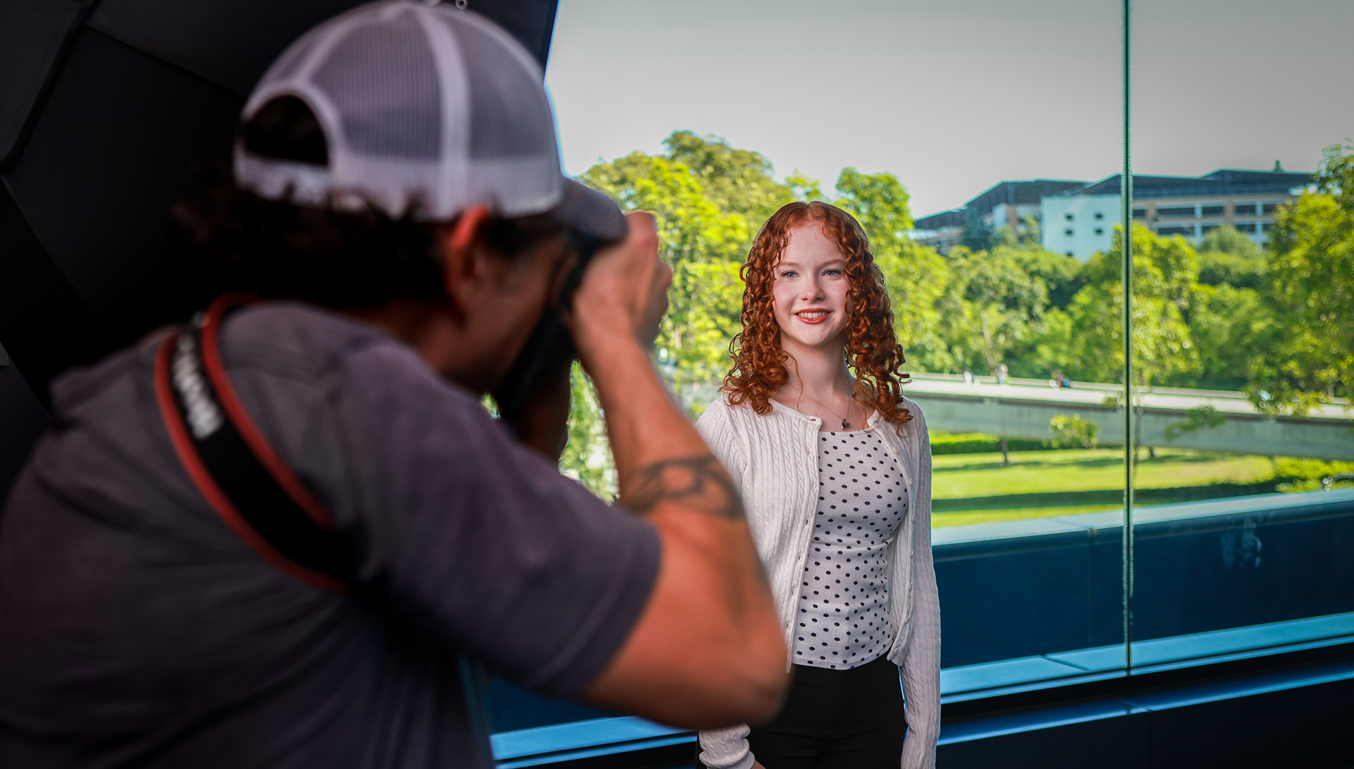photographer shoots photo of student
