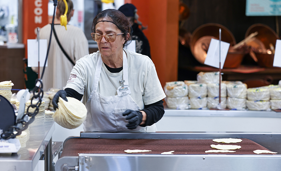 woman making tortillas