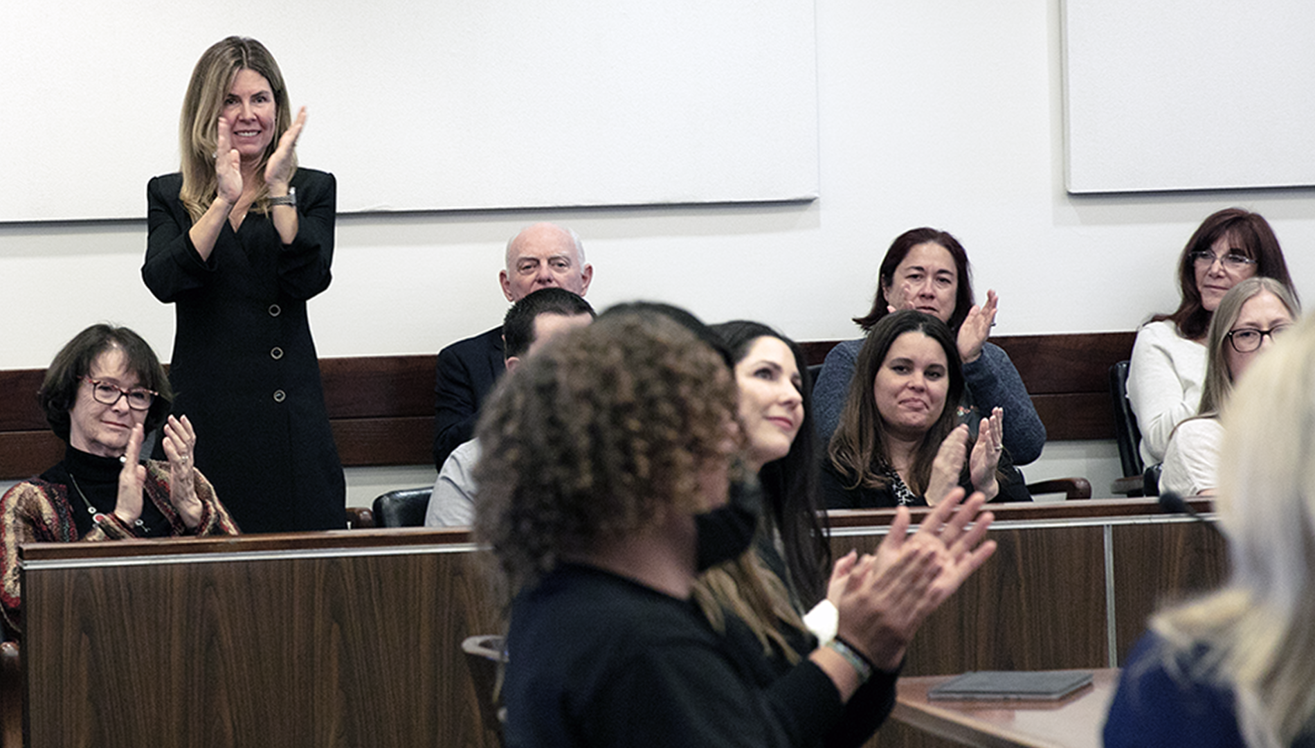 Elizabeth Cauffman applauding in court