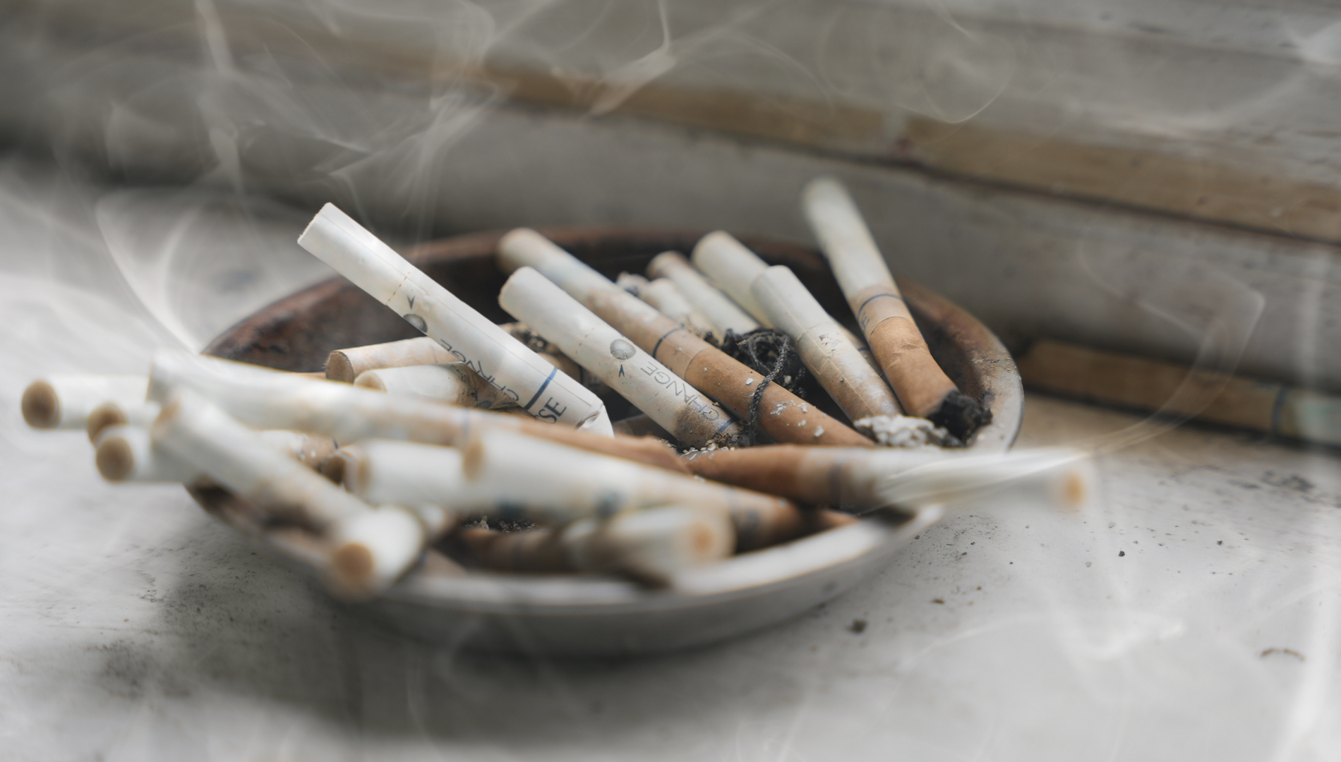 ashtray full of cigarettes