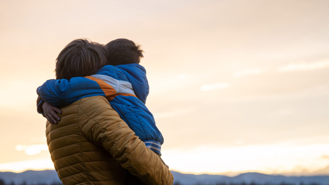 Parent hugging child