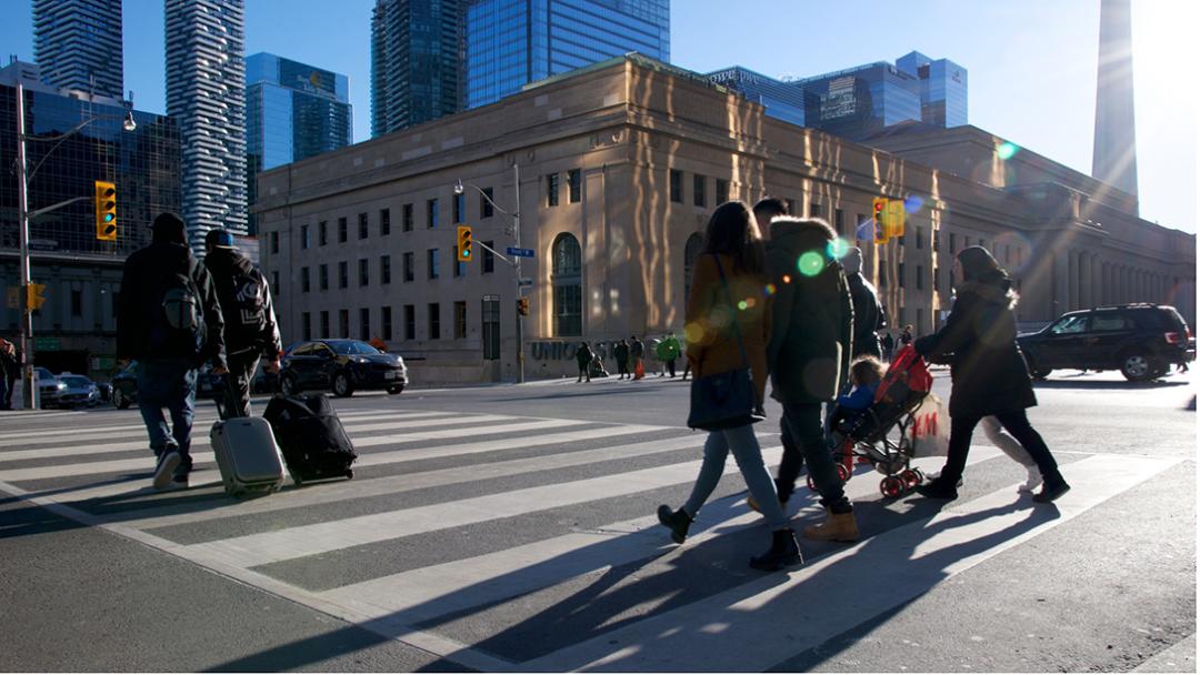 people walking across the street