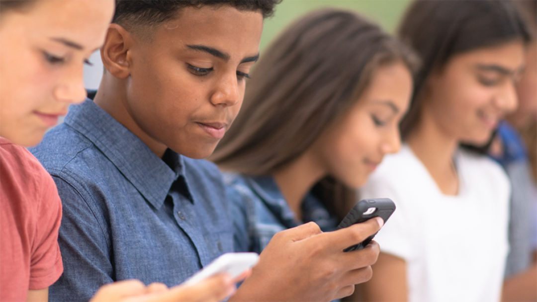 youth with cell phones