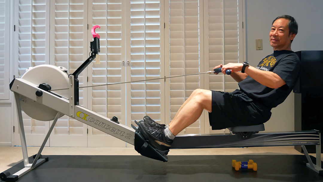 Ken Chew on rowing machine