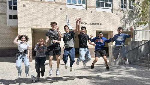 excited students jumping
