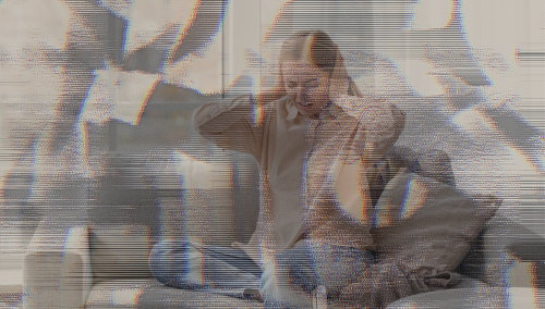 Distorted filter over woman holding her head and grimacing
