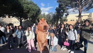 group of happy students and Professor Sarah Pressman