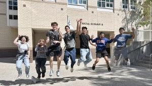 excited students jumping