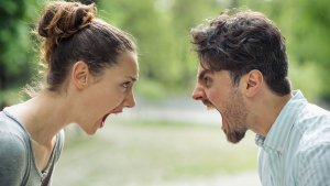 Angry couple facing off